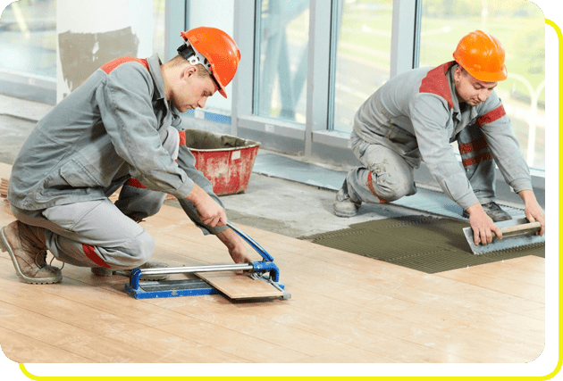 Two tilers at industrial floor tiling renovation